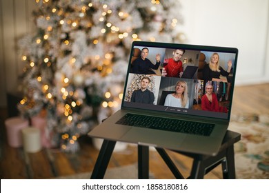 Virtual Christmas tree meeting team teleworking. Family video call remote conference. Laptop webcam screen view. Team meet working from their home offices. Happy hour party online woman team diversity - Powered by Shutterstock