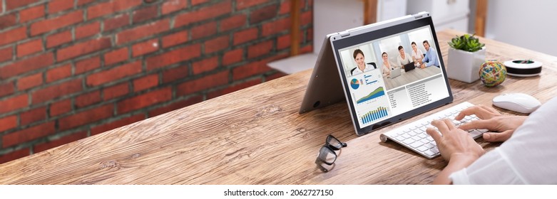 Virtual Conference Meeting In Office Room On Hybrid Convertible Laptop