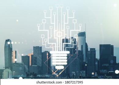 Virtual creative light bulb with chip hologram on Los Angeles office buildings background, artificial Intelligence and neural networks concept. Multiexposure