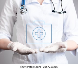 Virtual First Aid Kit Over Doctor Hands In Gloves. Immediate Assistance To Patient Suffering From Sudden Injury, Illness, Health Care, Medicine Concept. Woman In Lab Coat . High Quality Photo