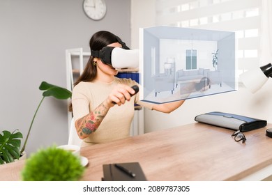 Virtual house tour. Young woman using a VR headset and joystick while making a real estate immersive tour  - Powered by Shutterstock