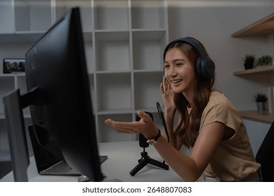 Virtual Interaction and Remote Work. Young woman smiling while participating in online meeting. - Powered by Shutterstock - Get 15% off with code: PIKWIZARD15