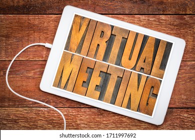 Virtual Meeting Word Abstract In Vintage Letterpress Wood Type On A Digital Tablet, Networking And Telecommunication Concept