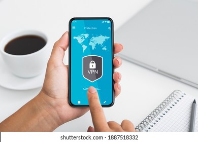 Virtual Private Network. Point of view of woman using smartphone with mobile vpn app, touching gadget screen, connecting to local network over the internet. Information and cyber security