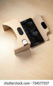 Virtual Reality Cardboard Headset With Smartphone On The Table. VR Glasses.