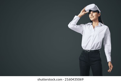 Virtual reality concept with young woman looking up and white VR headset on her head on abstract black background with place for your logo or text, mock up