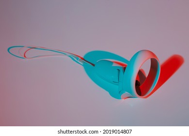 Virtual reality controllers for online and cloud gaming on white background in neon light. VR, future, gadgets, technology concept.