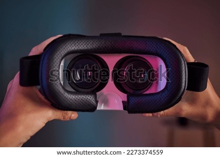 Virtual reality glasses in hands, metaverse and future technology, video gaming and UX with woman and cyber space. Innovation, digital world and VR headset with AR, software and female gamer