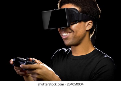 Virtual Reality headset on a black male with video game controller