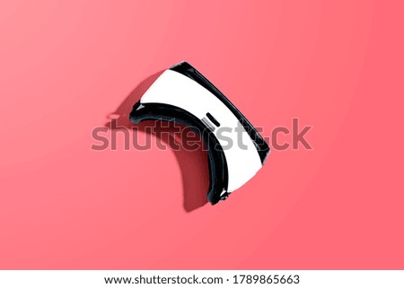 Virtual reality headset with shadow - flat lay