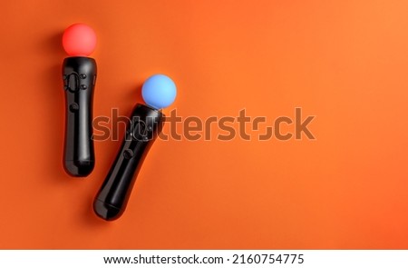 Virtual reality move controller on orange background