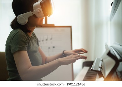 Virtual Reality Online Class Piano Lesson From Home, VR Musical Online Learning Conceptual. Piano Teacher Instructing Student From VR Technology. Virtual Education In Metaverse Technology.