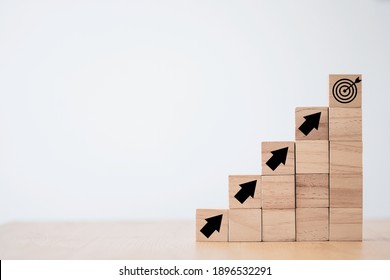 Virtual target board and increasing arrow which print screen on wooden cube. Business achievement goal and objective target concept. - Shutterstock ID 1896532291