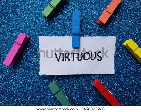Virtuous writting on blue background.