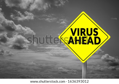 Virus ahead road sign with dramatic sky background
