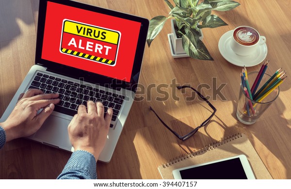 Virus Alert Warning Digital Browsing\
Concept man hand on table Business, coffee, Split\
tone