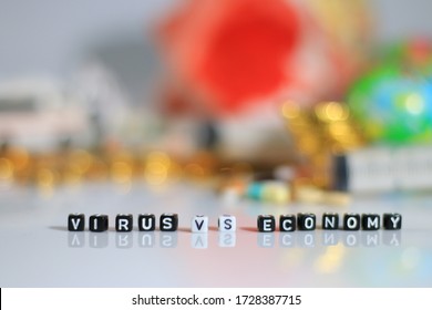 Virus Covid Vs Economy Alphabet With Background Globe World ,money And House With Bluring