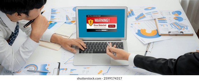 Virus warning alert on computer screen detected brisk cyber threat , hacker, computer virus and malware