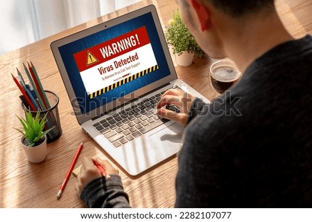 Virus warning alert on computer screen detected modish cyber threat , hacker, computer virus and malware