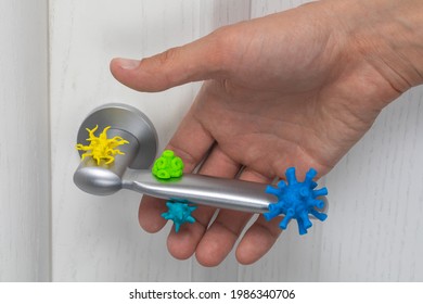 Virus-infected Doorknob. The Man Takes The Handle With Viruses And Germs