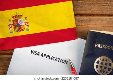 Visa application form, passport and flag of Spain  - Shutterstock ID 2233184087