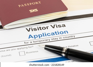 Visa Application Form With Passport And Pen