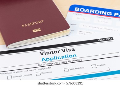 Visa Application Form With Red Passport, And Boarding Pass