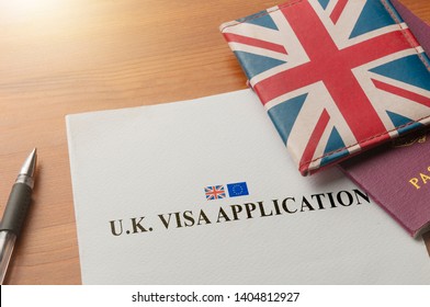 Visa Application On Desktop With Passport And Union Jack Wallet