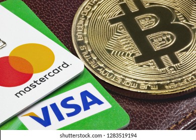 Visa, Mastercard Credit Cards  And Golden Bitcoin With The Leather Wallet On The Background.