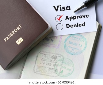 Visa and passport to  approved stamped on a document top view in Immigration - Shutterstock ID 667030426