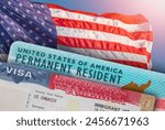 VISA United States of America. Green Card US Permanent resident. Work and Travel ID documents. US Immigrant.  Visa for Immigration. Embassy USA. Visa in passport. American flag on background