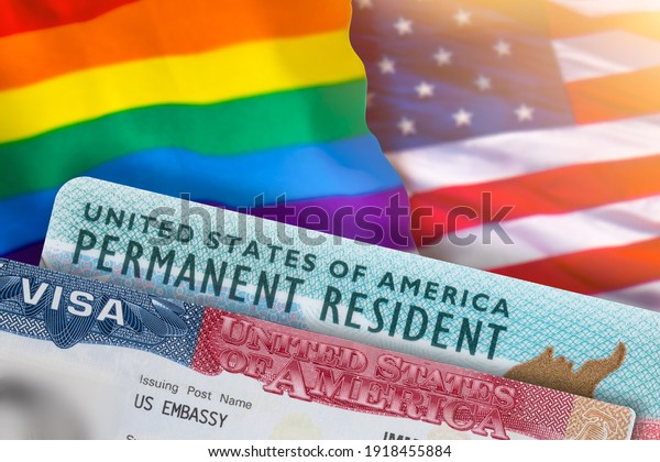 VISA United States of America. Green Card US\
Permanent resident. Work and Travel documents. US Immigrant.\
Rainbow flag symbol gays and lesbians LGBT. Embassy USA.\
Immigration Visa in\
passport.
