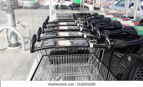 Visby, Gotland, Sweden. 08-20-2019. Holding A Shopping Cart Outside A Grocery Store, Stora Coop, A Co-operative Union, A Large Retail Chain. Now Empty, But Soon Filled, To Stock Up At Home. 