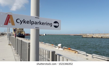 Visby, Gotland, Sweden. 08-20-2019. A sign from Almedalsveckan, a political week, where members of the parties discuss in Almedalen. The sign pointing out to the water, talking about parking bicycles.