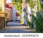 Visby, Sweden. Street with colorful buildings in historical Visby town. Scandinavia, Gotland, Northern Europe