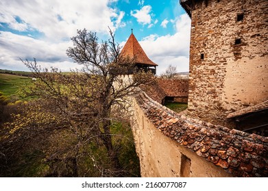 Viscri, Romania: Blue old painted traditional house from village, Transylvania, German Saxon community. Unesco. The Viscri fortified church