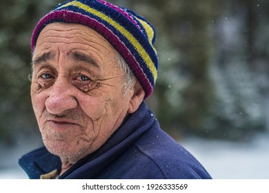 Viseu de Sus, Maramures, Romania - January 15 2016: Portrait of an old man from North Romania working at old railway 