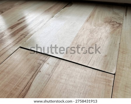 Visible gap between laminate floor panels indicating installation or expansion issue