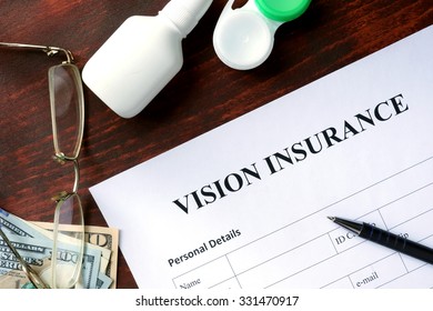 Vision Insurance Form On The Wooden Table.