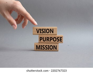 Vision Purpose Mission symbol. Concept word Vision Purpose Mission on wooden blocks. Beautiful grey background. Businessman hand. Business and Vision Purpose Mission concept. Copy space. - Shutterstock ID 2202767323