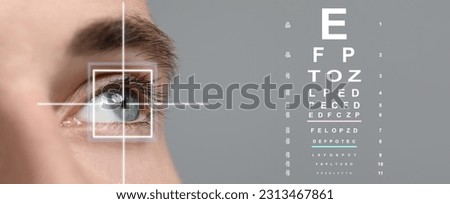 Vision test chart and laser reticle focused on man's eye against light grey background, closeup. Banner design