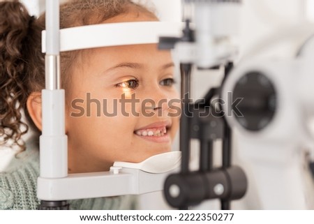 Vision, test and girl for eye exam in the opthalmologist office with equipment for glasses. Optics, examination and female child testing for eyecare health or wellness for optometry for healthcare [[stock_photo]] © 