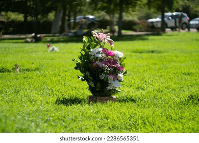 visit to the cemetery with bouquets of flowers