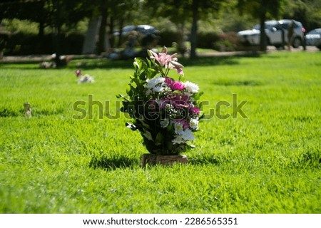 visit to the cemetery with bouquets of flowers