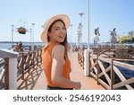 Visiting Aracaju, Brazil. Young woman turns around to the camera on promenade Largo da Gente Sergipana in Aracaju, Sergipe, Brazil.