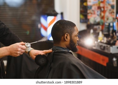 Visiting Barbershop. African American Man In A Stylish Barber Shop