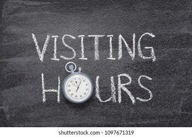 Visiting Hours Phrase Handwritten On Chalkboard With Vintage Precise Stopwatch Used Instead Of O