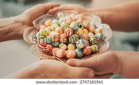 Visiting relatives and offering candy during Eid al-Fitr celebration