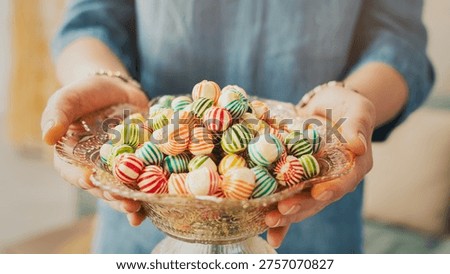 Visiting relatives and offering candy during Eid al-Fitr celebration