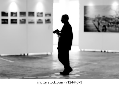 Visitor At Photography Art Gallery Exhibition Display